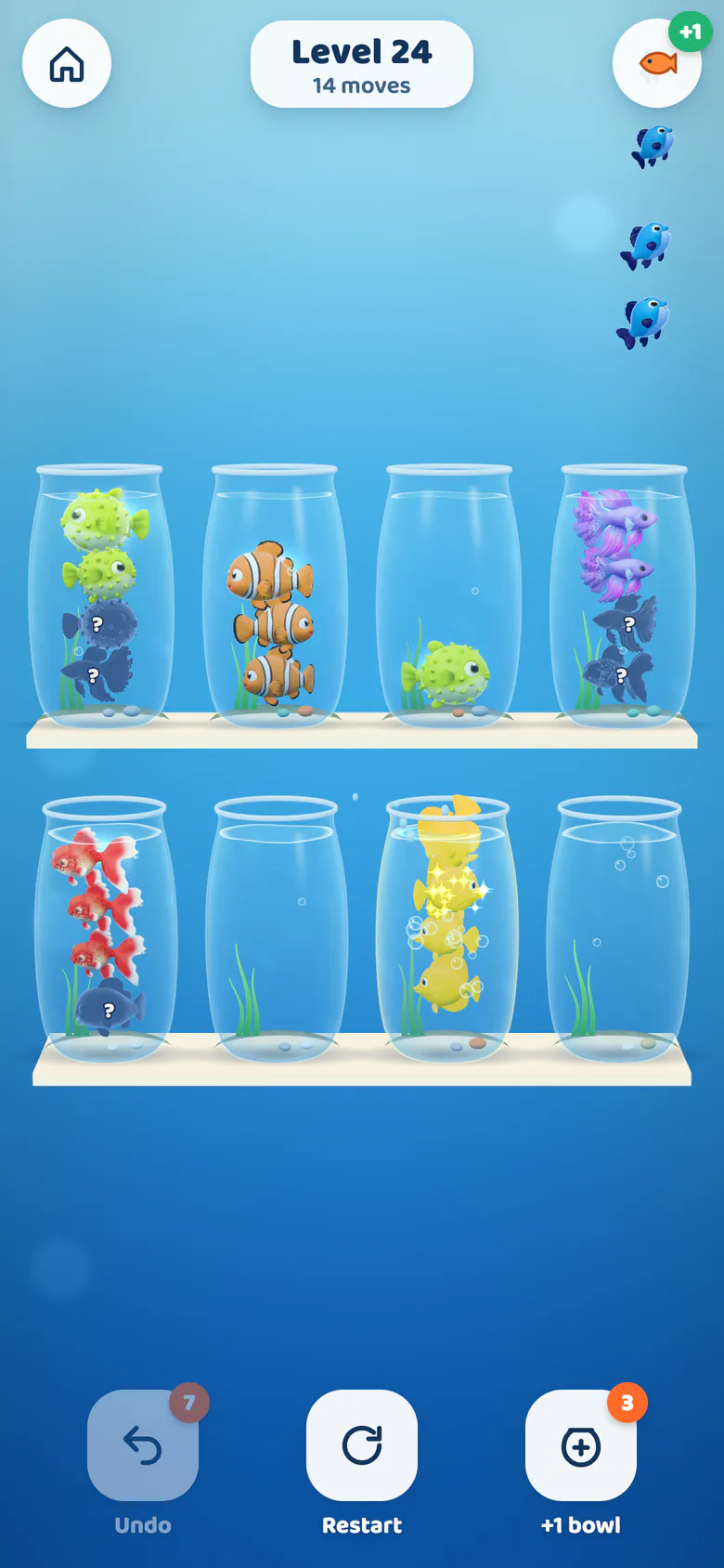 A bowl of four yellow tangs spins and sparkles while three sorted blue tangs swim off to the aquarium.