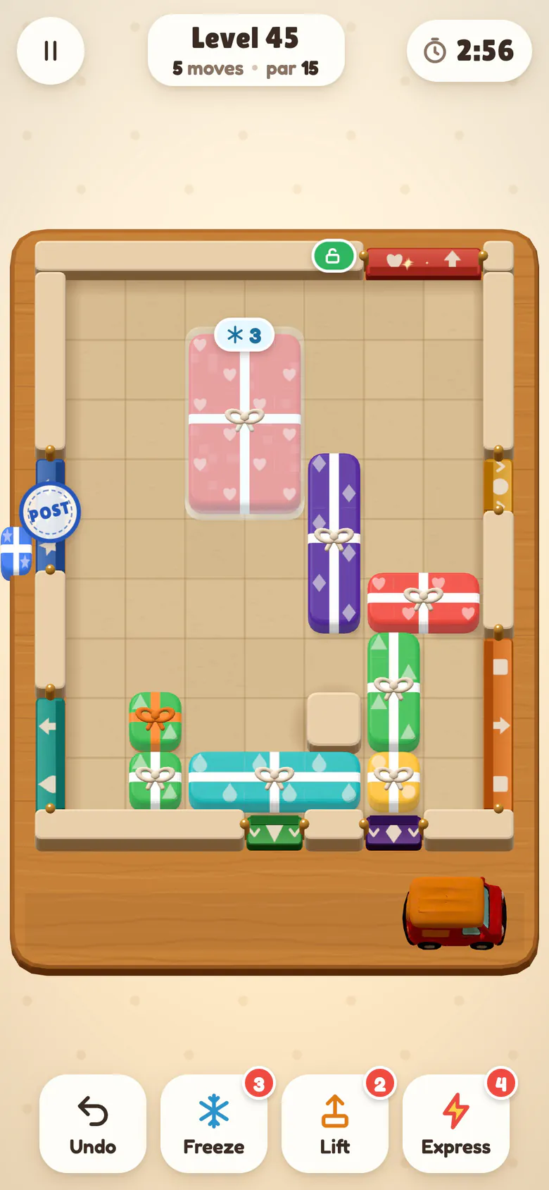 Level 45: a padlock above a chute turns green as the chute opens, a frozen parcel waits under ice with a counter of 3, and a blue parcel slides out through its chute with a postmark stamp.