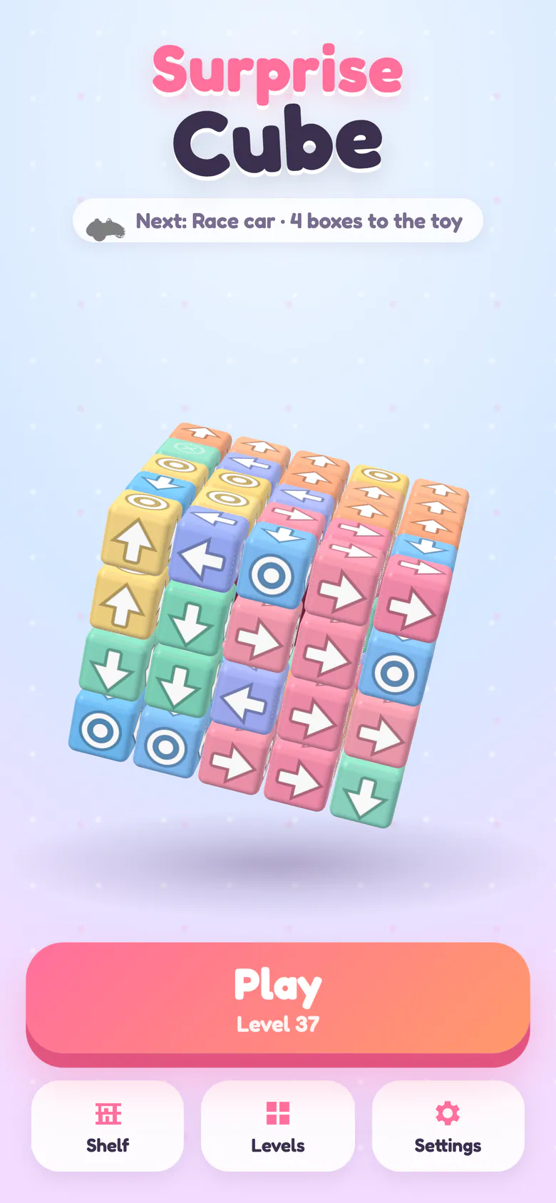 Surprise Cube title screen: a 5×5×5 cube of candy-coloured arrow blocks, the next toy goal and the Play button.