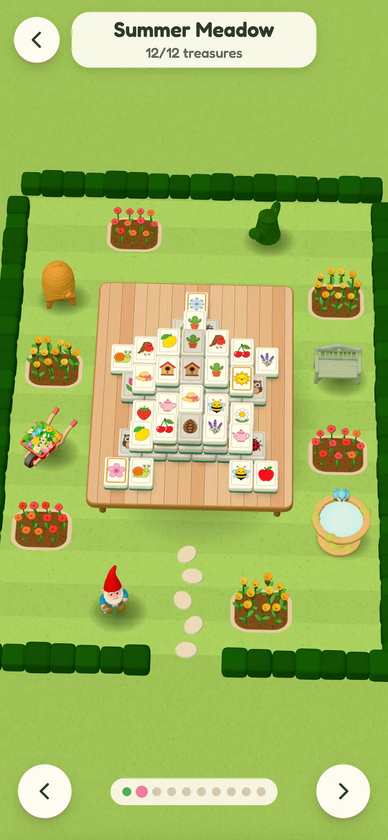The Gardens screen: the Summer Meadow complete at 12 of 12 treasures, with a gnome, a beehive, a bench, a birdbath, a wheelbarrow and a watering can among flower beds around the garden table.